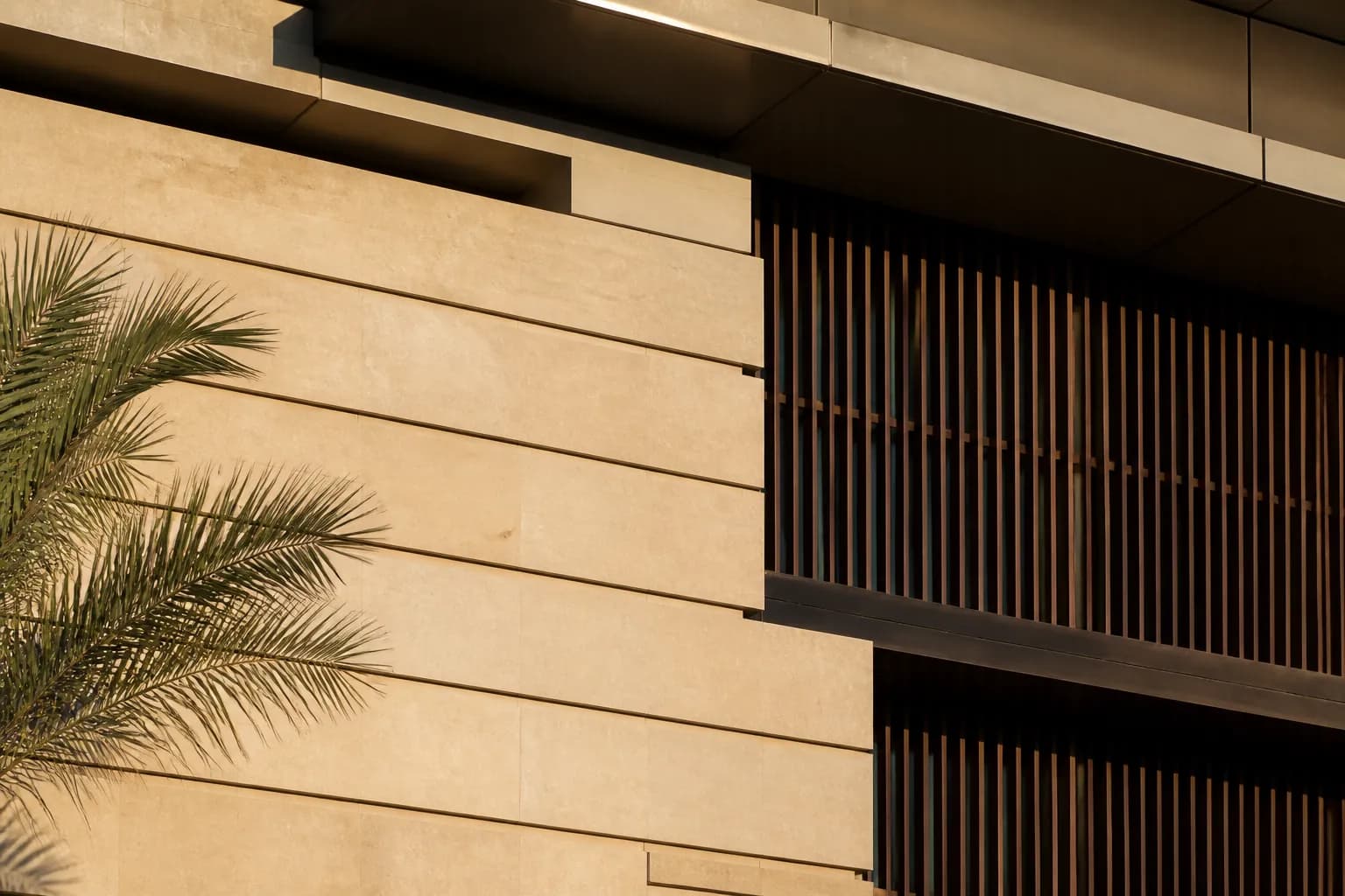Limestone facade with bronze screens